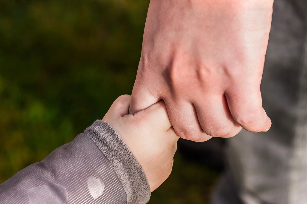 Parent and child holding hands — Los Angeles child custody attorney